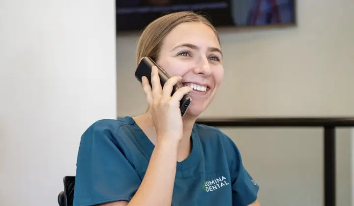 Luminadental staff on phone call regarding Dental consultation by a patient